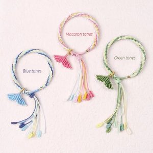 Set of customizable fish tail bracelets in blue, macaron, and green hues. Handcrafted and stylish accessory.