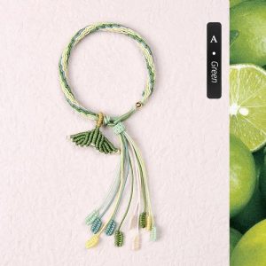 Customizable green fish tail bracelet. Handcrafted accessory with a unique ocean-inspired design.