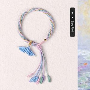 Customizable blue and pink fish tail bracelet. Handcrafted accessory with a charming ocean-inspired design.