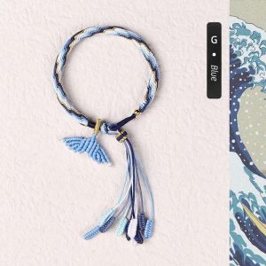 Customizable blue fish tail bracelet. Handcrafted accessory with a serene ocean-inspired design.