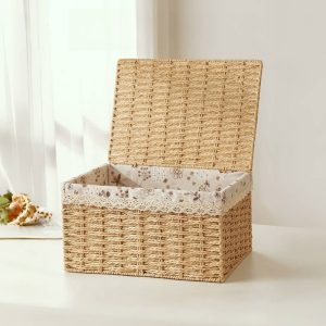 An image of a versatile bamboo woven storage box with a lid, suitable for desk organization, snack storage on coffee tables, and clothing storage in closets.