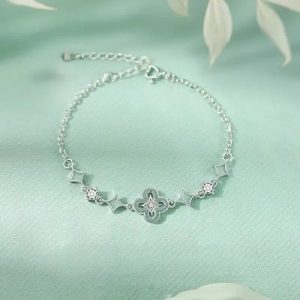 Close-up of a handcrafted sterling silver bracelet with blue and white porcelain-inspired hues, exquisitely detailed and perfect for Valentine's Day and birthday gifts.