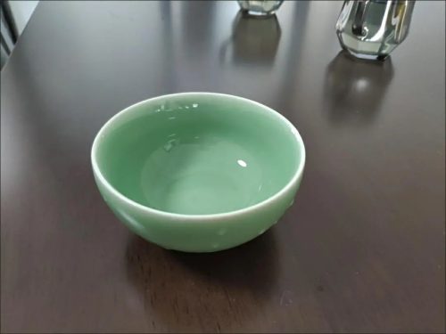 review for a beautifully crafted Longquan Celadon bowl, ideal for dining, showcasing a classic blue-green glaze.